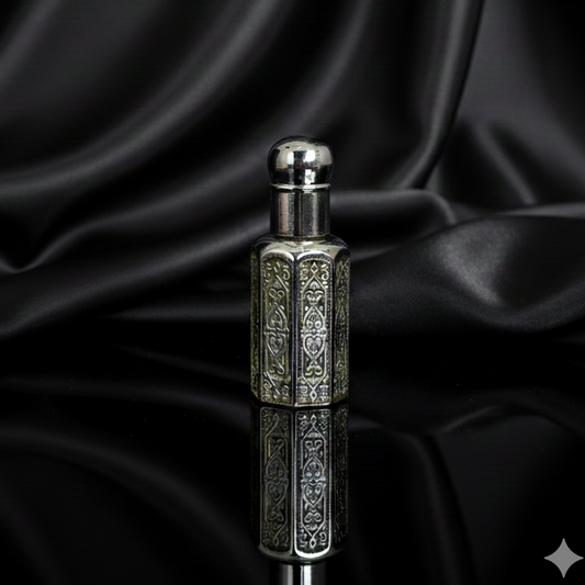 Silver perfume bottle on a black satin background